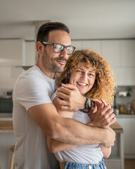 Happy adult caucasian couple at home husband and wife family concept