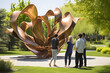 Art enthusiasts attending an outdoor sculpture garden tour on a sunny day.