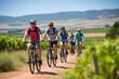 Cyclists on a guided tour of vineyards stopping occasionally to sample wines and local cheeses.