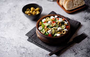 Wall Mural - Spinach cucumber pepper orzo salad in a bowl