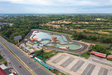 Poster - Aerial view of square landmark monument with residential neighborhood roofs. Urban housing development from above. Top view. Real estate in Isan urban city town, Thailand. Property real estate.