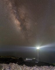 Wall Mural - lighthouse at night under the stars of the milky way (el hierro, canary islands)