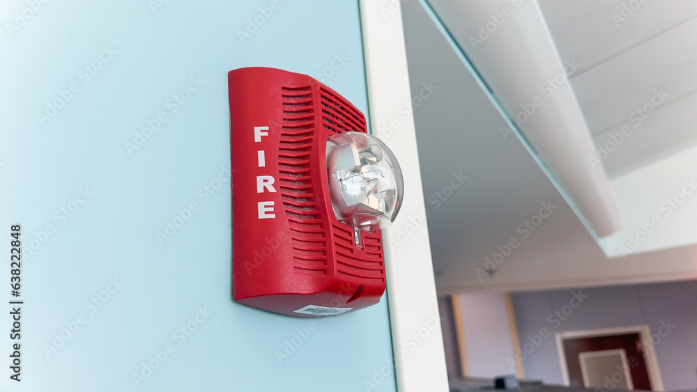 Vivid fire alarm, a symbol of urgency and safety, warns of danger ...