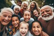 © dreamalittledream - A diverse group of faces of from different cultures, kids, parents and grandparents, the elderly, aunts, uncles, friends and neighbours, kids, siblings, full of joyful celebration, selfie style family