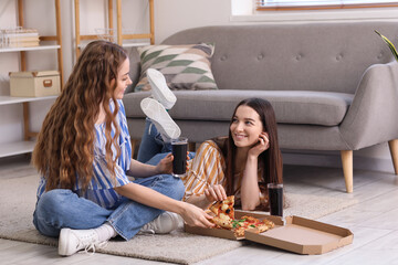 Canvas Print - Young women with tasty pizza and cola at home