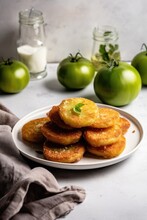 Deep Fried Green Tomato Slices On A White Marble Background