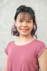 Wall Mural - Happy teen girl 11-15 year old. Portrait beautiful woman smiling with perfect smile and white teeth. asian lady girl wear casual cloth with smiling looking at camera on gray background.