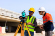© SHUTTER DIN - Engineer use theodolite equipment for route surveying to build a bridge across the intersection to reduce traffic congestion during rush hours. .