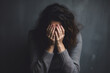 © AspctStyle - Depressed young woman covering her face with her hands. Young Woman Coping with Distress by Covering Her Face. mental health concept.