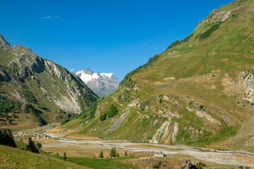 Wall Mural - beautiful landscape in european alpine valley with the glacier of Mont Blanc background