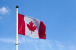Canadian lag waving atop of its pole