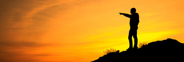 man in mountain at the sunset