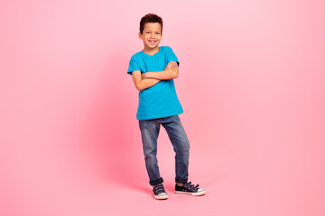 Poster - Full length photo of cute confident little boy dressed blue t-shirt smiling arms crossed isolated pink color background