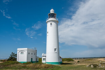 Wall Mural - Hurst Point Lighthouse is located at Hurst Point in the English county of Hampshire, and guides vessels through the western approaches to the Solent