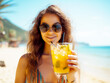 © millenius - First-person view. Girl holds a glass cup of cold orange fresh on the background of a sandy tropical beach. White sand and a boat. AI generated