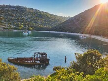 Gocek Is Populer Tourist Destination. Caption: Natural Mud Spring. Natural Greenery Tourist Area. Luxury Yachts Anchored In A Sunny Island Bay. Green Blue Canyon River And Boat. Vertical Photo