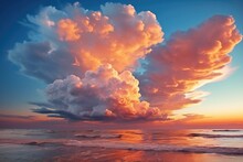 Beautiful Sunrise Over Ocean Or Sea. Blue Sky And Colorful Cumulonimbus Cloud Over Water Surface.