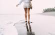 © BullRun - Crop unrecognizable woman walking on seashore