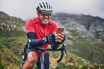 happy man, cyclist and phone on mountain bicycle in communication, social media or networking in nat