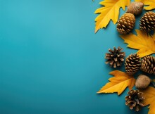 Autumn Leaves And White Pine Cones On Turquoise Background