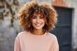© JetHuynh - beautiful woman with afro hair smiling on a bright background, smiling portrait