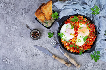 Wall Mural - Shakshuka with grilled bread. Fried eggs with tomato, pepper, garlic and herbs