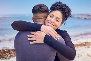 Wall Mural - Fitness, face and couple hug at a beach for sports, training and morning cardio in nature. Love, smile and happy woman embrace man at the ocean for running, workout or wellness exercise with support