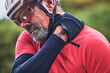 © LuneVA/peopleimages.com - Man, cyclist and neck injury in sports accident, emergency or broken bone and fitness in nature. Closeup of male person or athlete with sore pain, ache or joint inflammation from cycling or fall