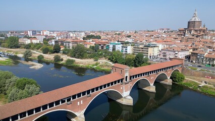 Wall Mural - Europe, Italy , Pavia - Drone aerial view of Pavia City in Lombardy with Ponte Coperto (  covered bridge ) on the Ticino and Po' river and during drought and summer aridity 