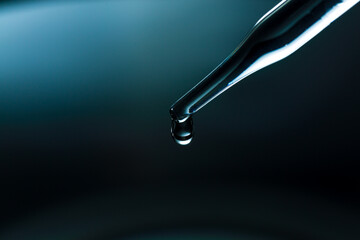 Wall Mural - water droplets macro science experiment,liquid drop from laboratory glass pipette
