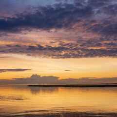 Wall Mural - natural landscape with a beautiful sunset over the wide northern lake