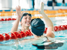 Fitness, Swimmer And Women With High Five, Celebration And Achievement With Workout, Wellness And Winning. Exercise, Winner Or Champion In A Pool, Celebration Or Support With Success, Sports Or Smile