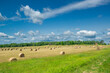 Farm with hay and meadow.