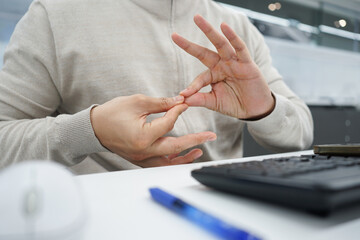 close up employee man hand gesture about stop sign language to teaching or assist colleagues from meeting in office room for business lifestyle concept