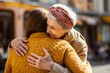 Close up image elderly woman hugs younger relative girl. Grown up adult daughter or granddaughter enjoy moment cuddle to old mom or aged granny. Family bond, together in trouble and happiness concept
