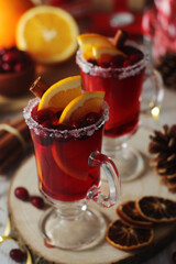 Wall Mural - Glasses with warm cranberry with oranges drinks