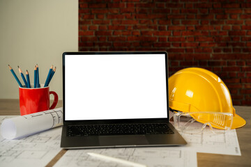 Wall Mural - architect engineers working on a desktop computer on a laptop mockup screen with an architectural pr