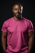 © Elle Arden  - An attractive man wearing a pink shirt with plain background. Generative AI.