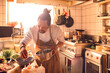 © Marko Geber - Male asian chef preparing a traditional food dish in a restaurant kitchen