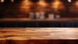 © Imam Lutfi - Empty wooden table with cafe kitchen background