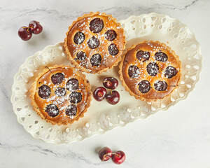 Canvas Print - French Flair, Cherry Clafoutis Presented on White Marble. Mouthwatering Temptation: Clafoutis and Cherries on Marble