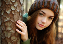 Young Girl Hiding Behind A Tree
