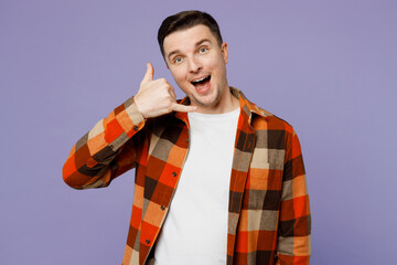 Wall Mural - Young happy man he wearing checkered shirt white t-shirt casual clothes doing phone gesture like says call me back isolated on plain pastel light purple background studio portrait. Lifestyle concept.