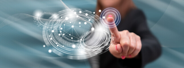Wall Mural - Woman touching a virtual technology concept