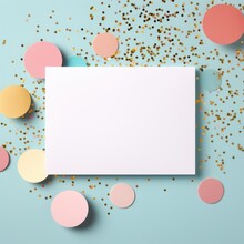 White Greeting Card Over Scattered Colorful Sequins And Confetti On Isolated Light Blue Background With Blank Space. Mockup Template. Flat Lay, Top View With Plase For Text