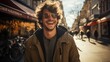 © Flowal93 - Happy smiling young man with brown hair wearing sunglasses walking down a street in a city on a beautiful sunny day