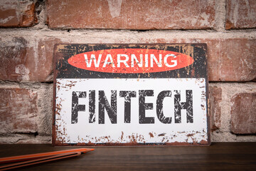 Wall Mural - fintech concept. warning sign on wooden texture office desk