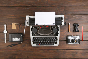 Wall Mural - Journalist or private detective workplace - typewriter, camera, hat, recorder and other stuff, flat view above