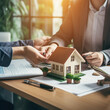 © GraphyPix - Concept of home loan and buying own property. Happy clients man and woman signing mortgage agreement for new home with real estate agent or realtor generative Ai