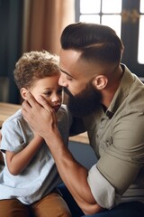 Wall Mural - shot of a young father comforting his crying son at home